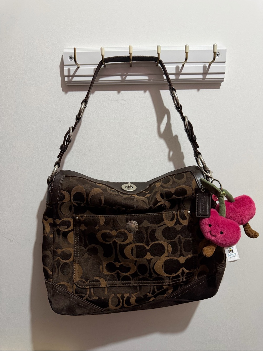 Coach Brown Signature Canvas Shoulder Bag with Pink Charm